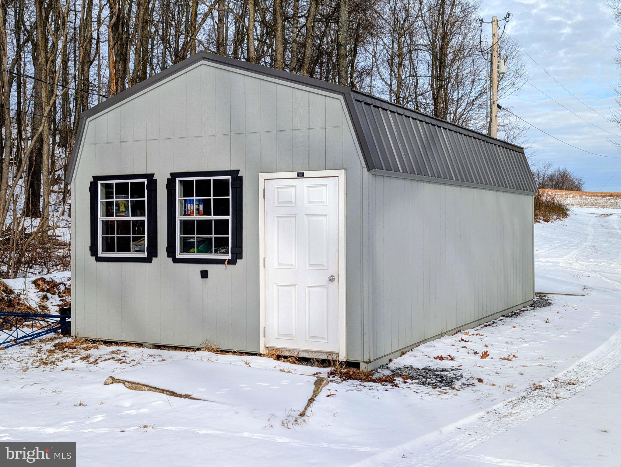 247 Short Cut Road Alum Bank, PA 15521 - Photo 13 of 15 a view of a house with a snow in the yard
