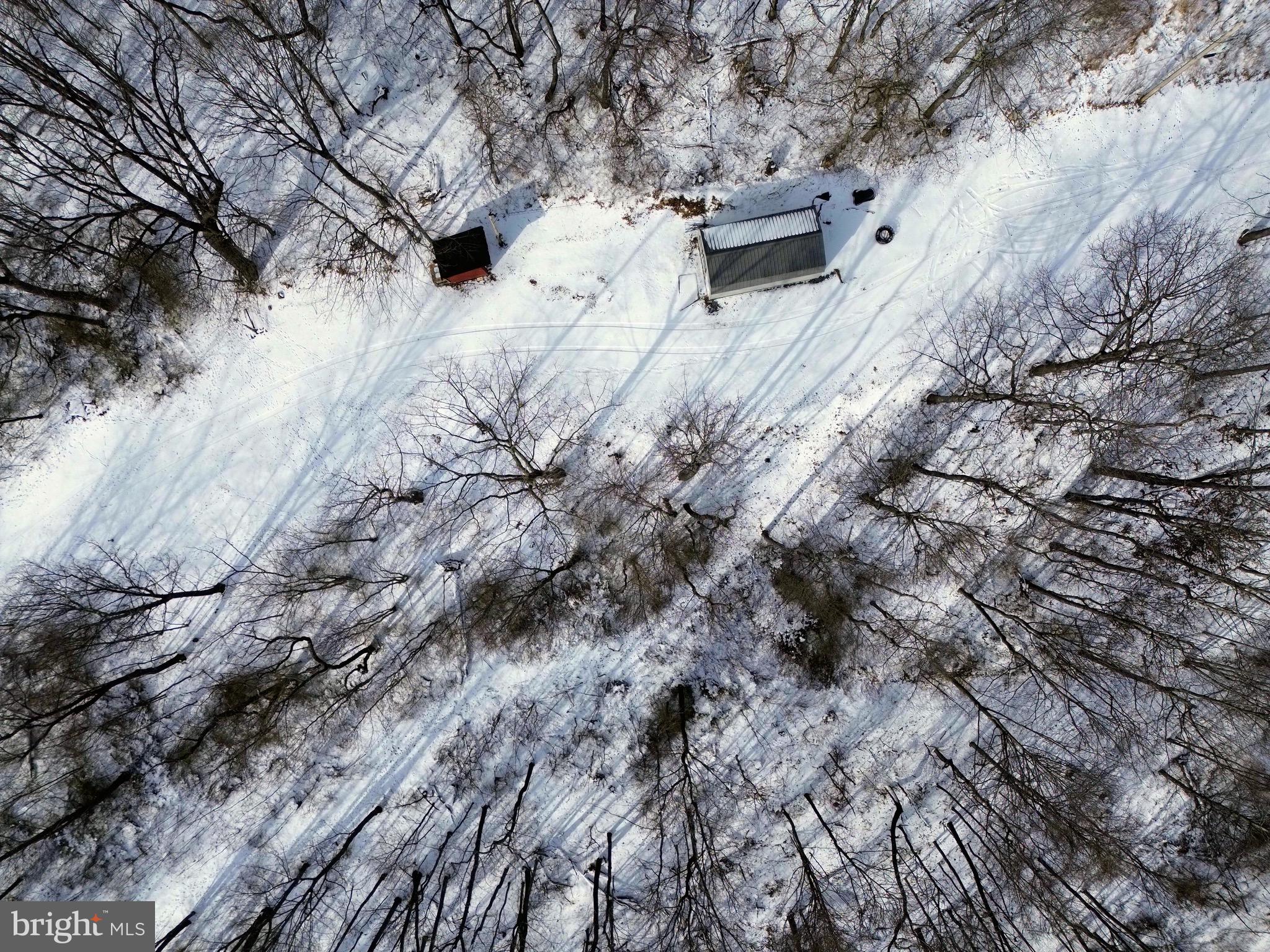 247 Short Cut Road Alum Bank, PA 15521 - Photo 3 of 15 a view of snow on side of road
