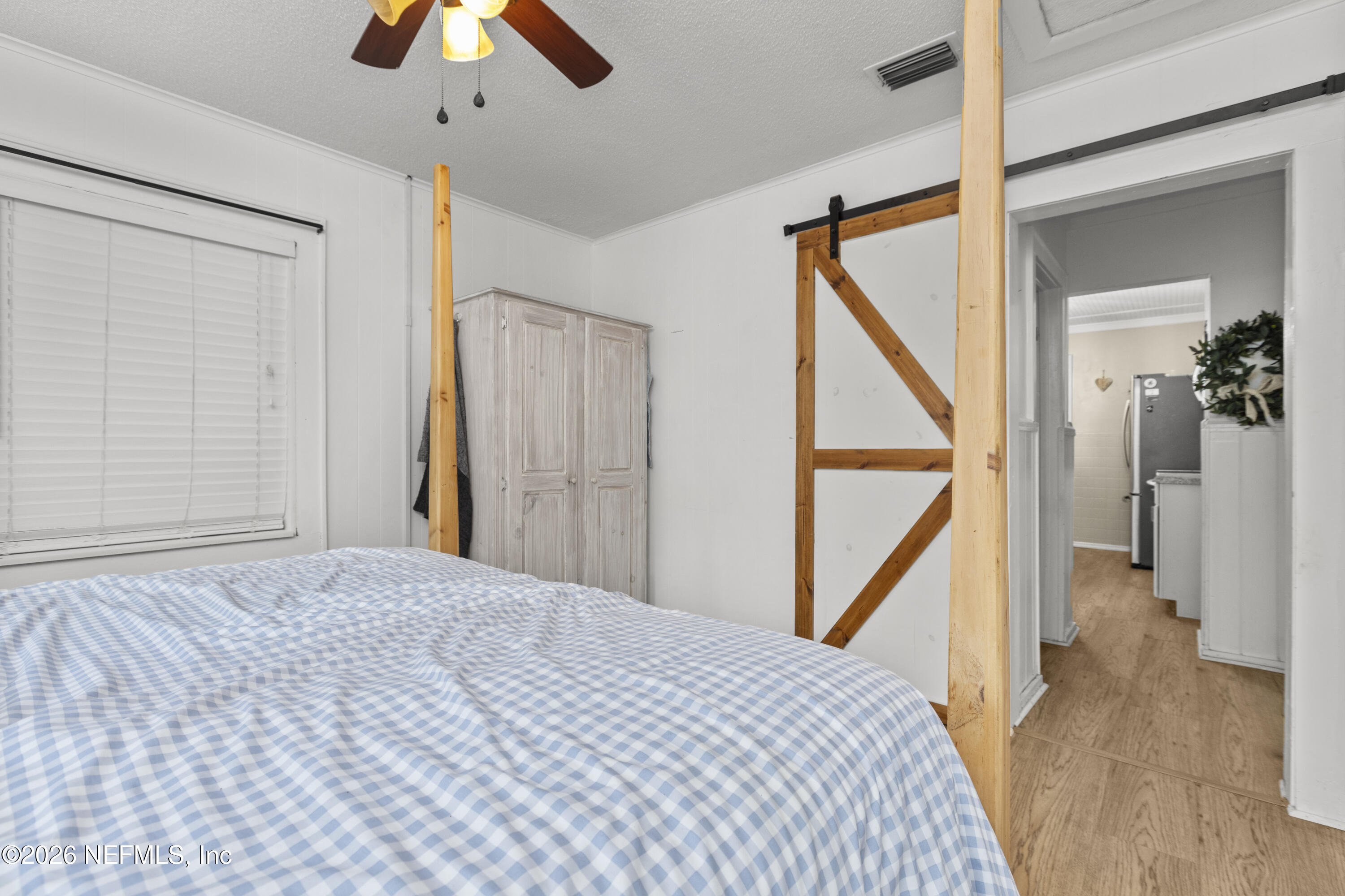 155 Roddy Road Palatka, FL 32177 - Photo 12 of 41 a bedroom with a bed and a window