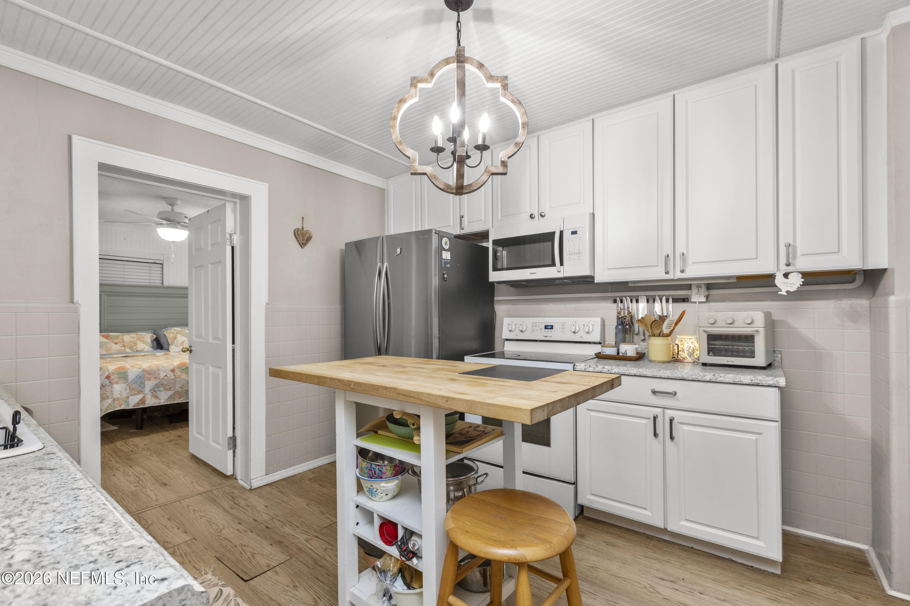 155 Roddy Road Palatka, FL 32177 - Photo 15 of 41 a kitchen with stainless steel appliances granite countertop a sink a stove a refrigerator and island