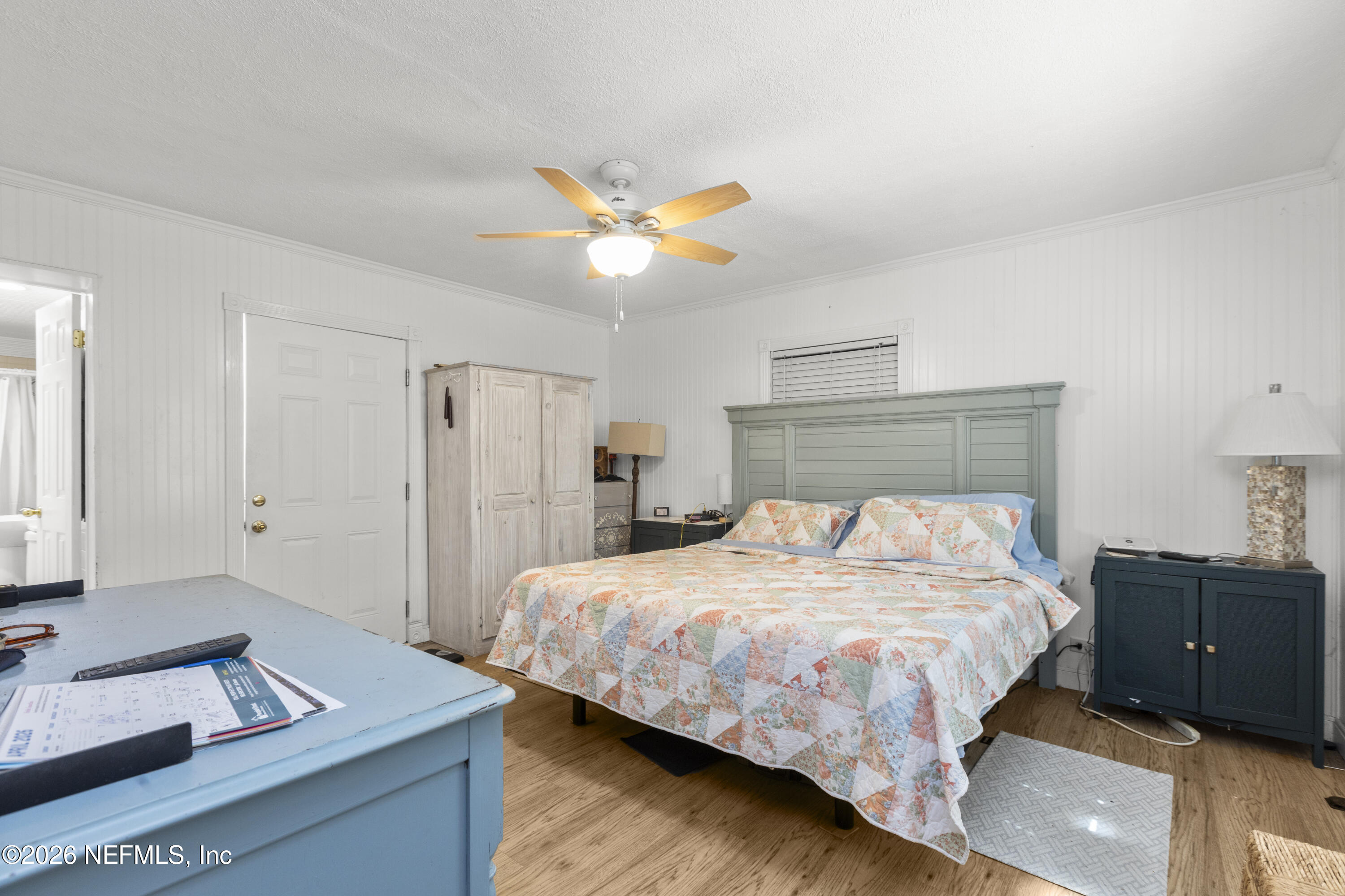 155 Roddy Road Palatka, FL 32177 - Photo 21 of 41 a bedroom with a bed and a chandelier