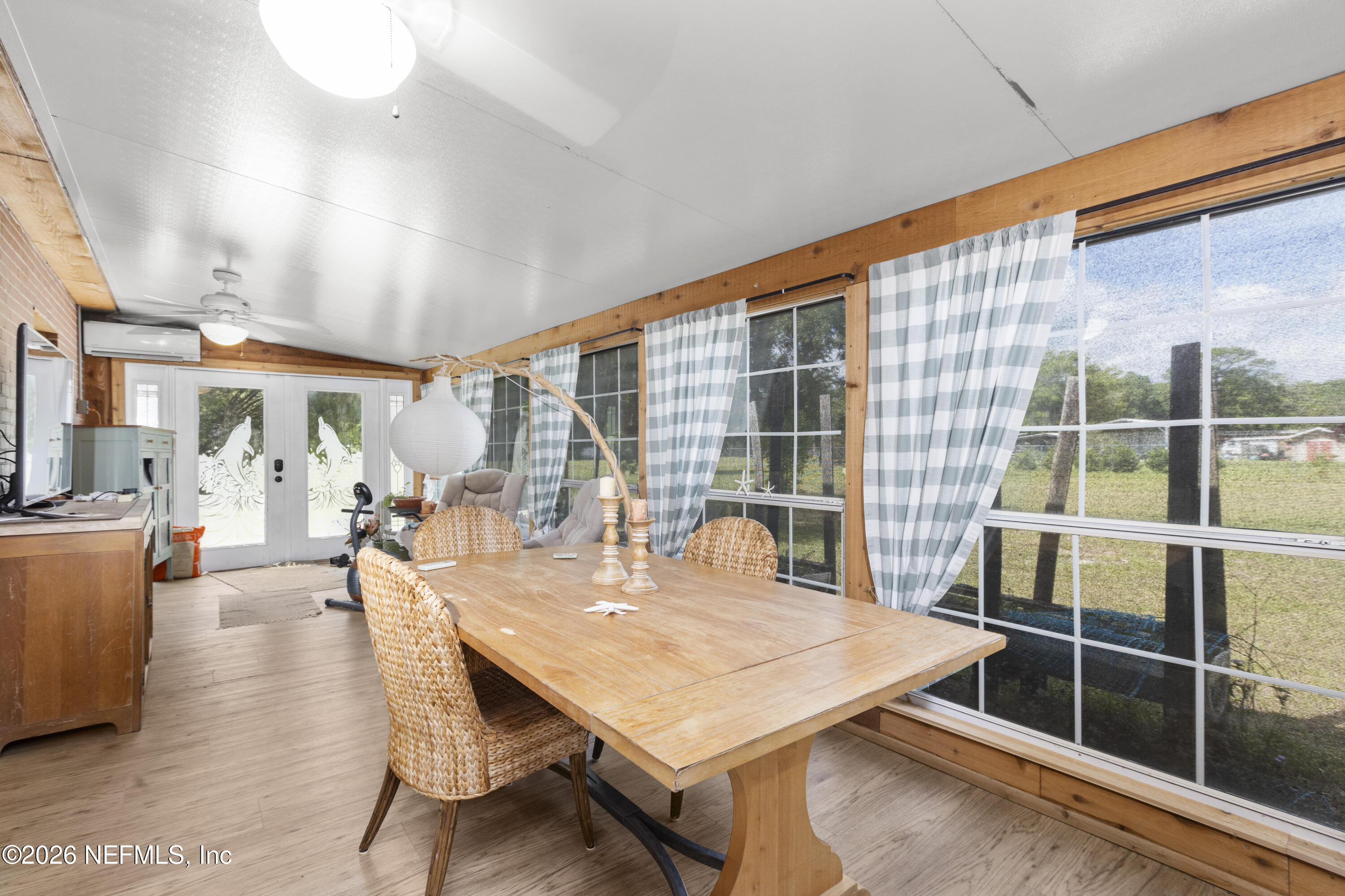 155 Roddy Road Palatka, FL 32177 - Photo 23 of 41 a dining room with wooden floor and large window