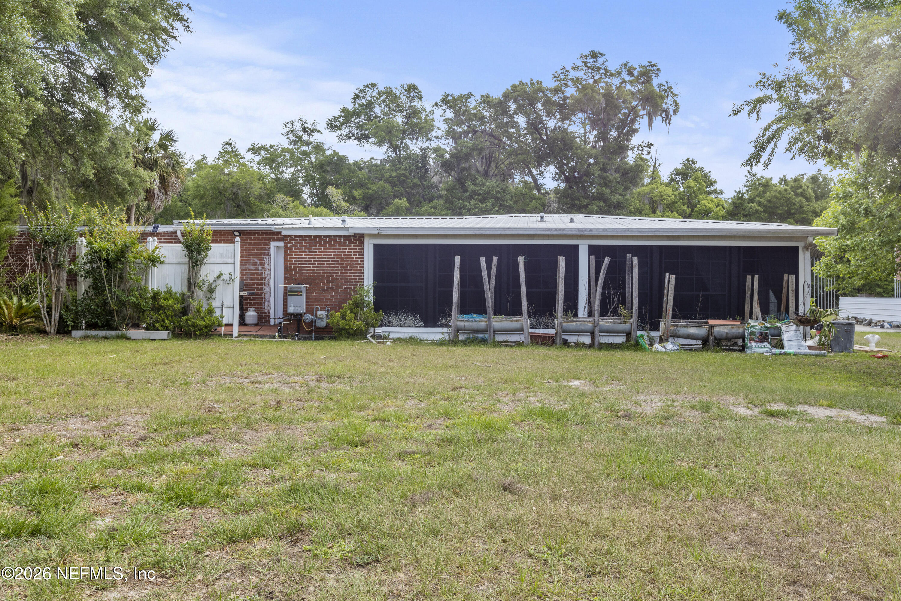 155 Roddy Road Palatka, FL 32177 - Photo 26 of 41 a view of a house with a yard and trees
