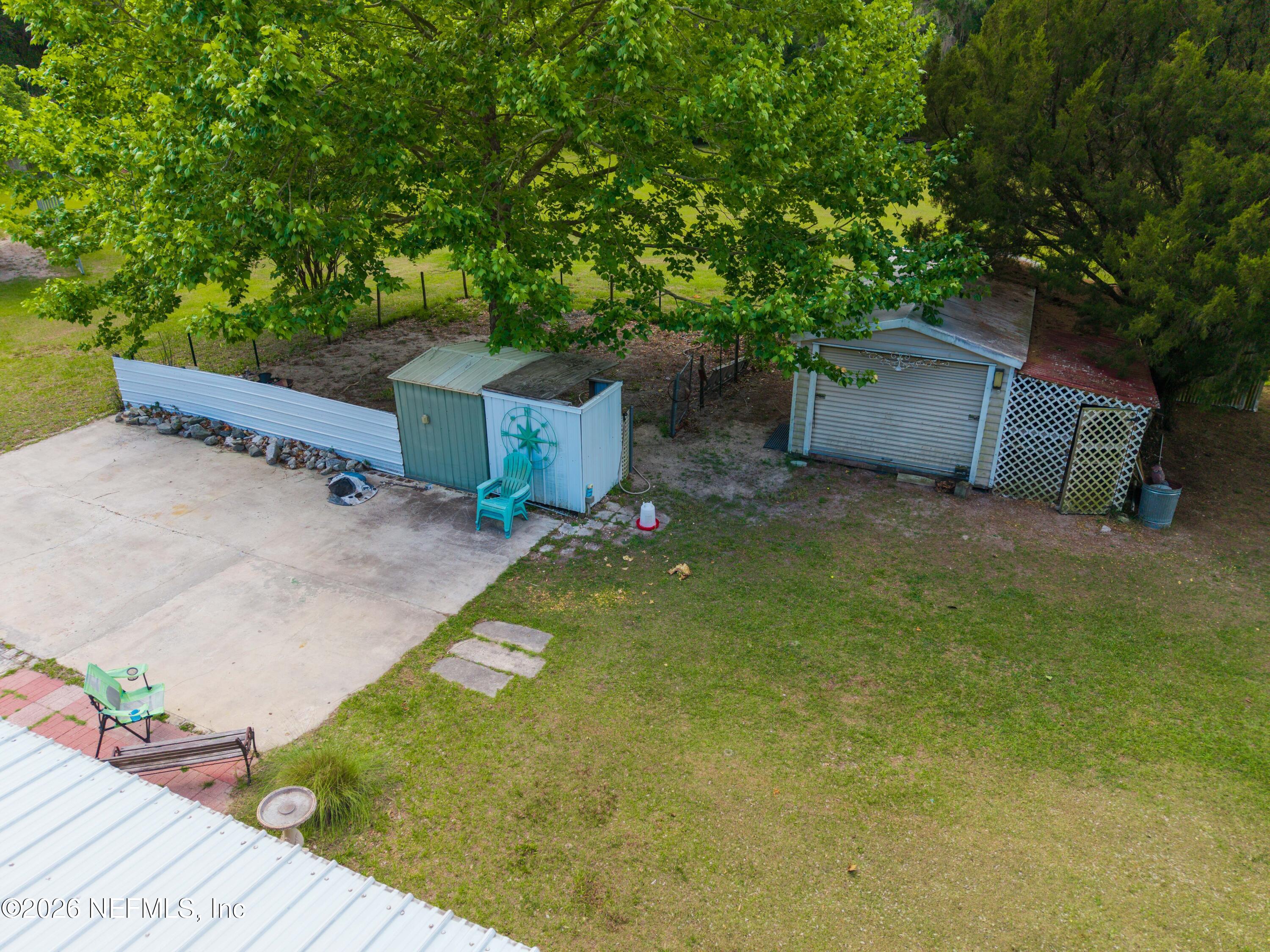 155 Roddy Road Palatka, FL 32177 - Photo 33 of 41 a backyard of a house with table and chairs