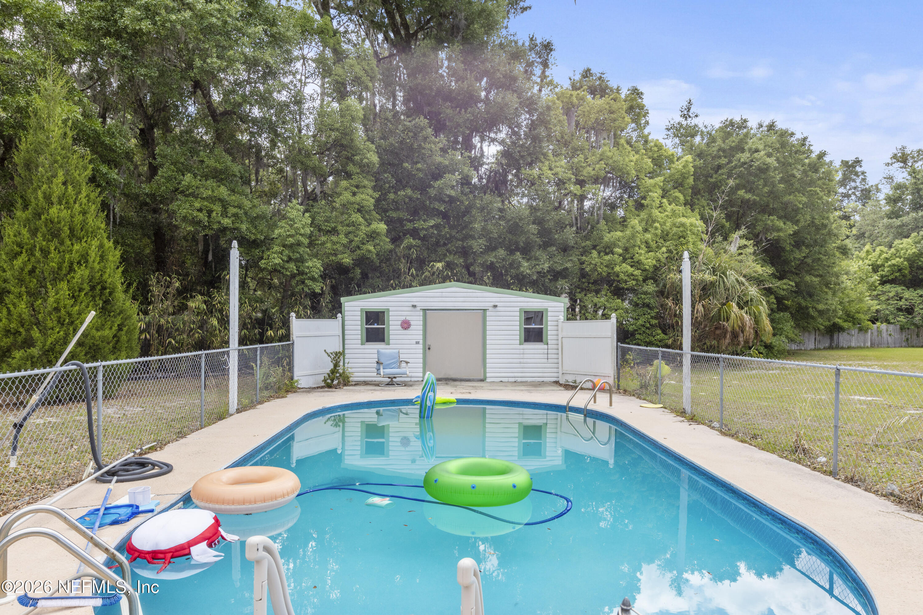 155 Roddy Road Palatka, FL 32177 - Photo 34 of 41 a swimming pool with some trees in the background