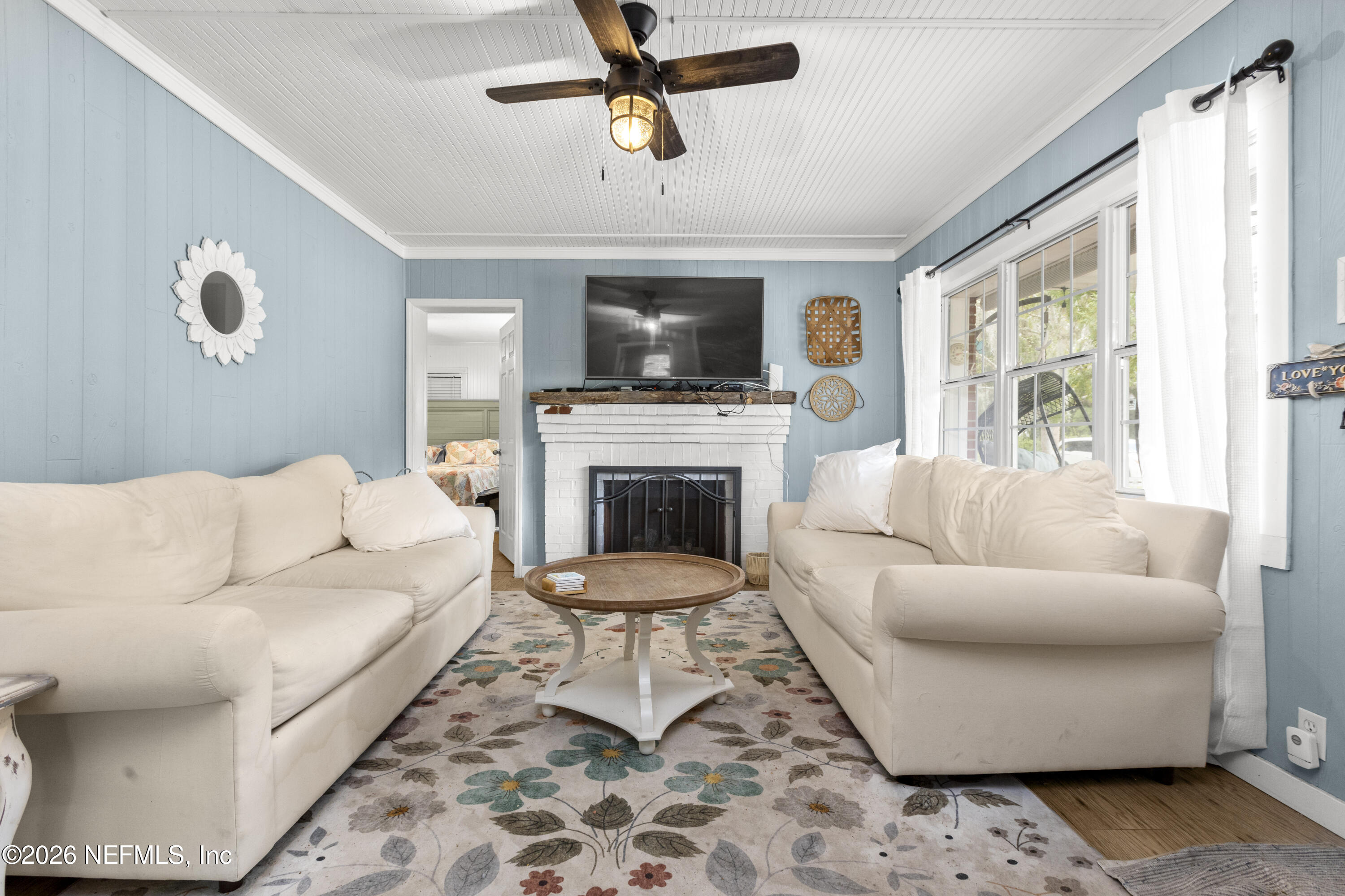 155 Roddy Road Palatka, FL 32177 - Photo 5 of 41 a living room with a couch and a fireplace