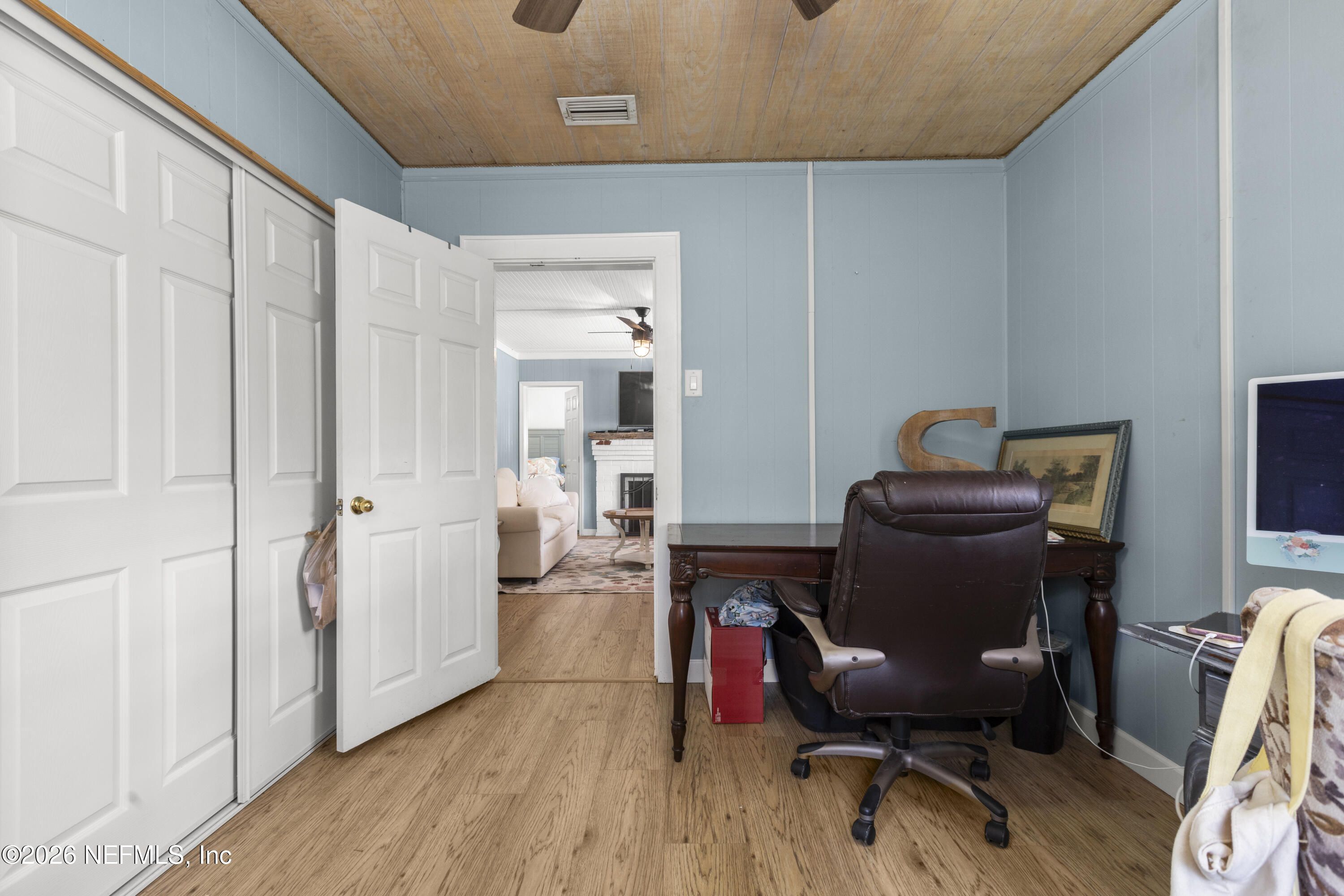 155 Roddy Road Palatka, FL 32177 - Photo 9 of 41 a view of a workspace with furniture and wooden floor