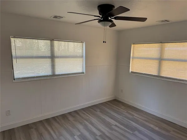a white toilet sitting next to a shower curtain
