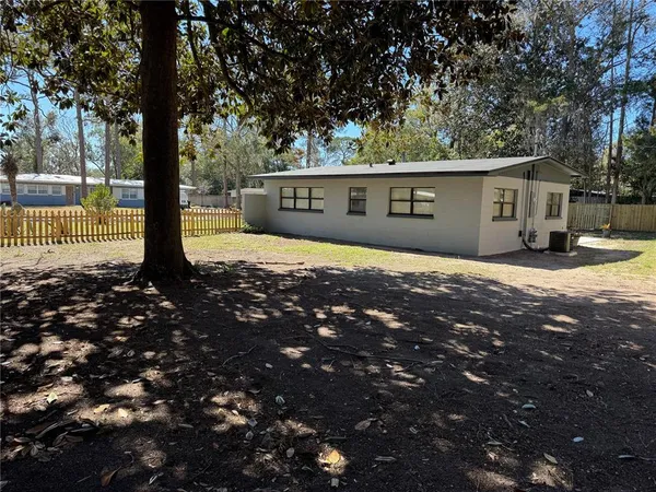 a view of a hallway with a wooden floor