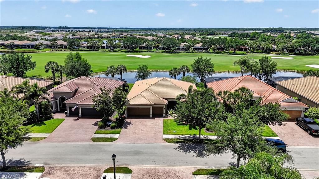 6124 Victory Drive Ave Maria, FL 34142 - Photo 2 of 50 an aerial view of a house with garden view and lake view