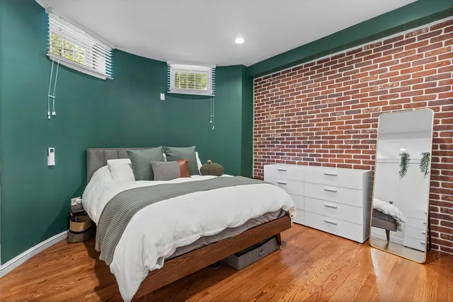 a bed room with a bed and a window