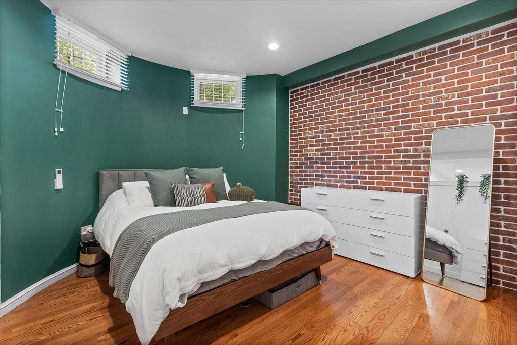 113 Chandler Street, Unit 1 Boston, MA 02116 - Photo 5 of 10 a bed room with a bed and a window