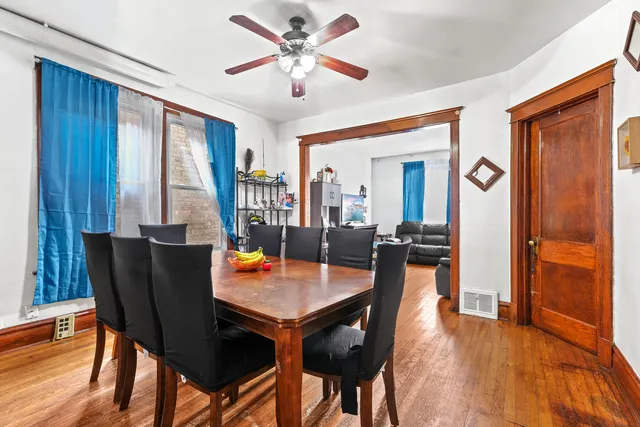 a dining room with furniture and window