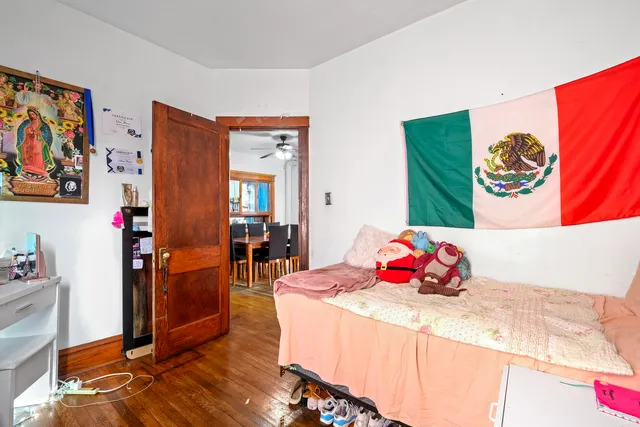 a bedroom with a bed and a couch