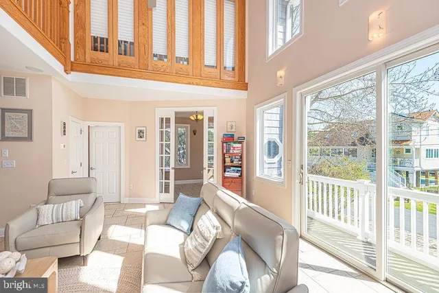 a bedroom with a bed window and a ceiling fan
