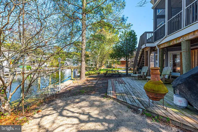 a view of a house with backyard porch and sitting area