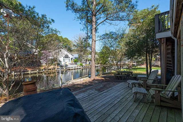 a view of a house with backyard stove and sitting area
