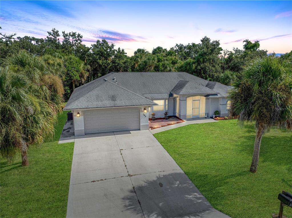 740 Citrus Road Venice, FL 34293 - Photo 1 of 1 front view of house with a yard