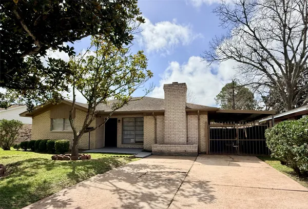 a house with a tree in front of it