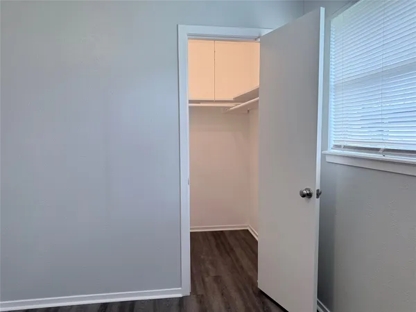 a view of front door with wooden floor