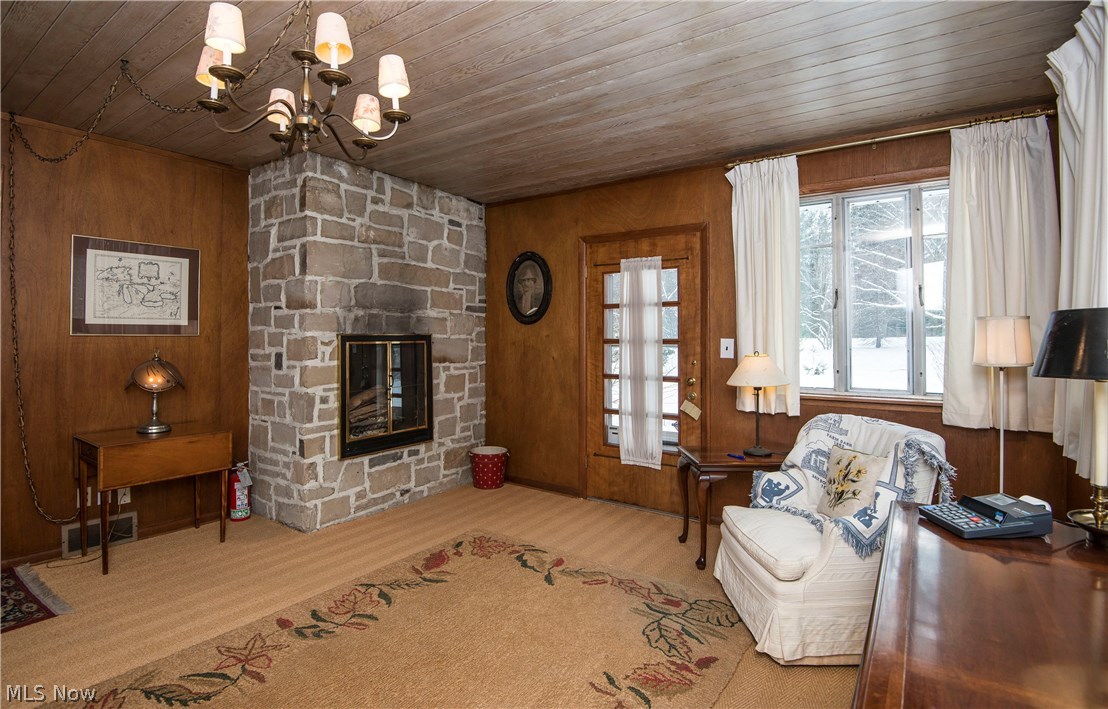 7844 Kinsman Road Novelty, OH 44072 - Photo 6 of 27 Another view of the sun room, including the working fireplace.