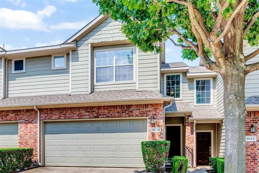 a view of a house with a tree