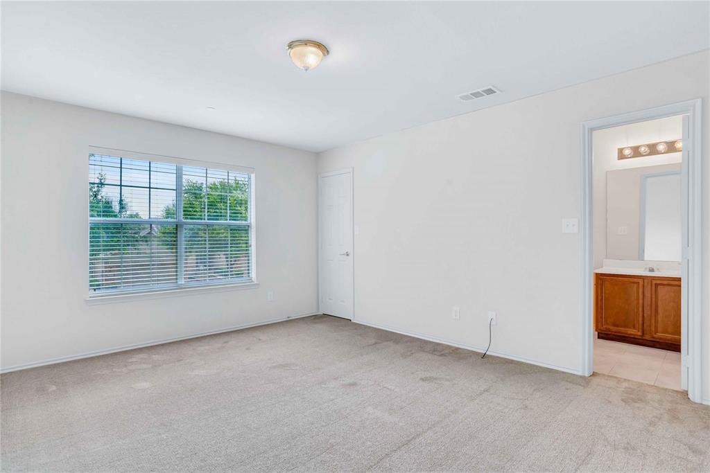 9845 Rockwall Road Plano, TX 75025 - Photo 11 of 14 an empty room with a window