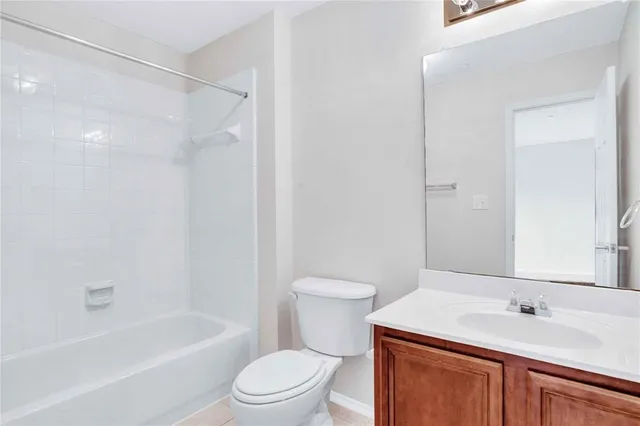 a bathroom with a sink a toilet and a bathtub