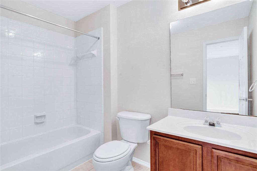 9845 Rockwall Road Plano, TX 75025 - Photo 12 of 14 a bathroom with a sink a toilet and a bathtub