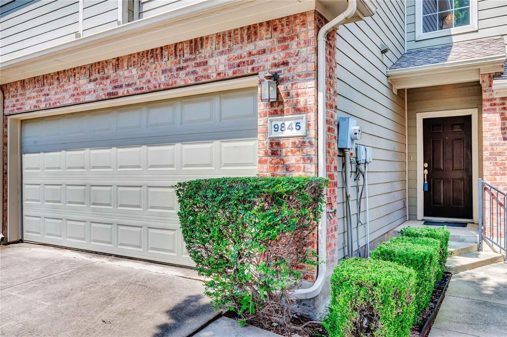 9845 Rockwall Road Plano, TX 75025 - Photo 2 of 14 a front view of a house with a garage