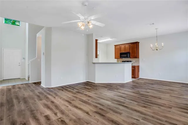 a view of kitchen with sink and natural light