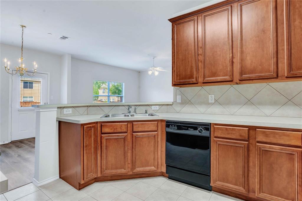 9845 Rockwall Road Plano, TX 75025 - Photo 8 of 14 a kitchen with granite countertop cabinets stainless steel appliances and a counter space