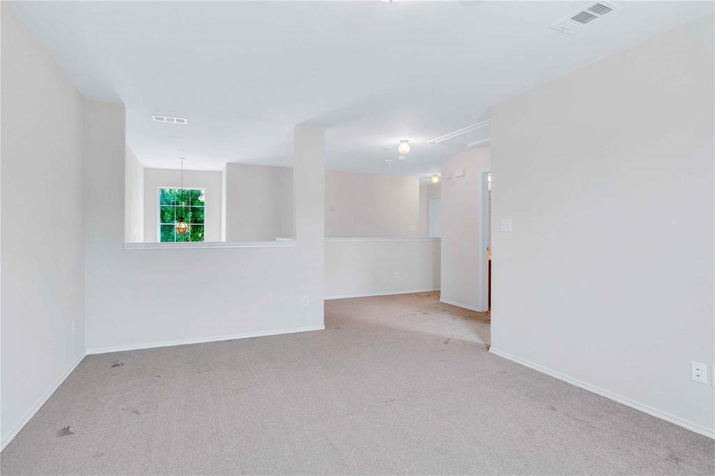 9845 Rockwall Road Plano, TX 75025 - Photo 10 of 14 an empty room with windows and closet