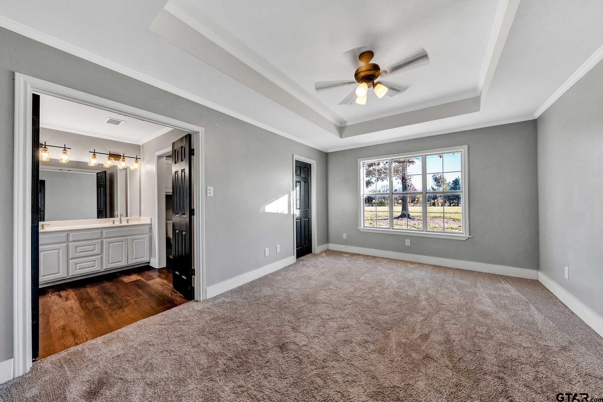 11670 Cr 345 Winona Tx 75792 Winona, TX 75792 - Photo 13 of 39 a view of a livingroom with a ceiling fan and window