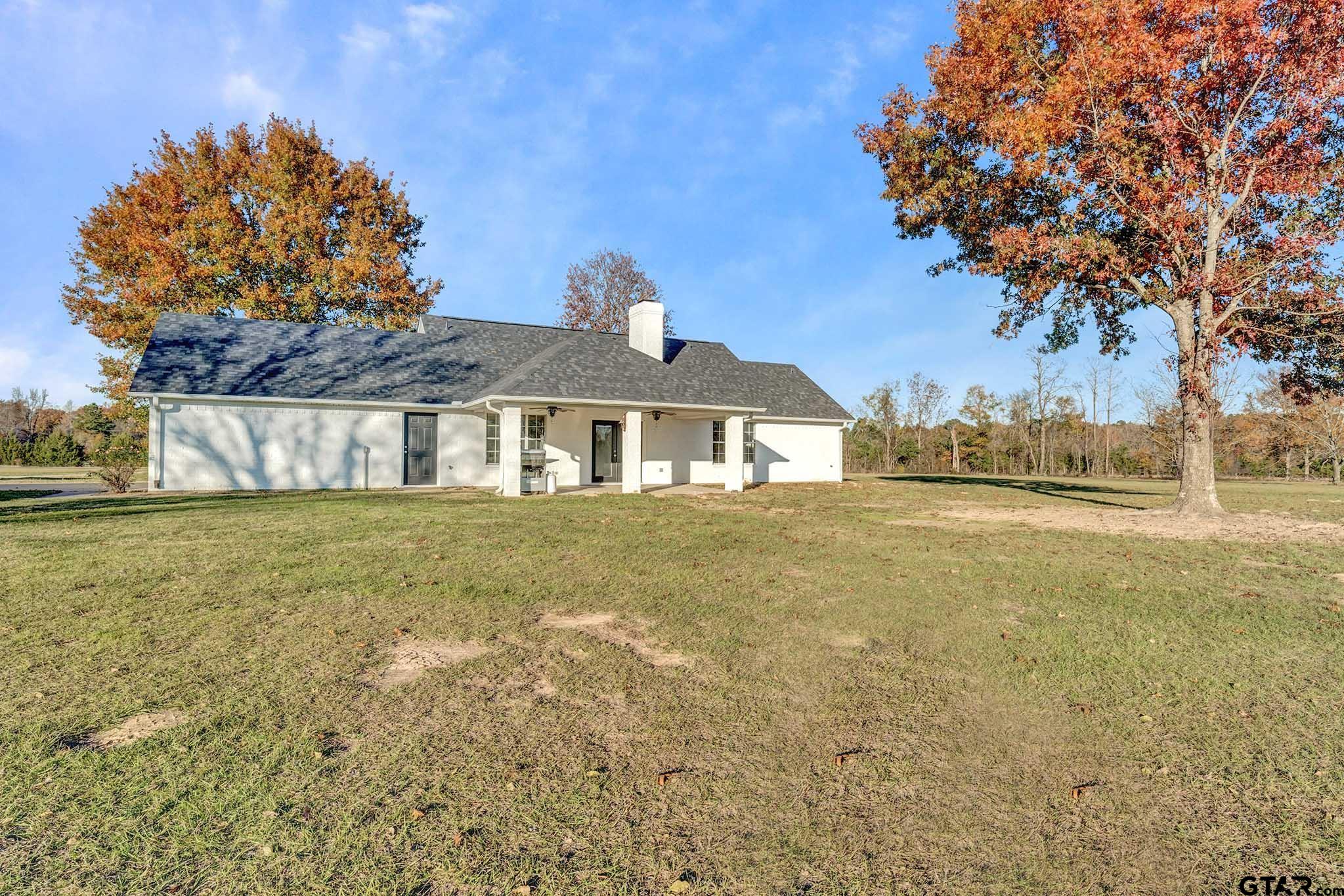 11670 Cr 345 Winona Tx 75792 Winona, TX 75792 - Photo 39 of 39 a front view of a house with a garden