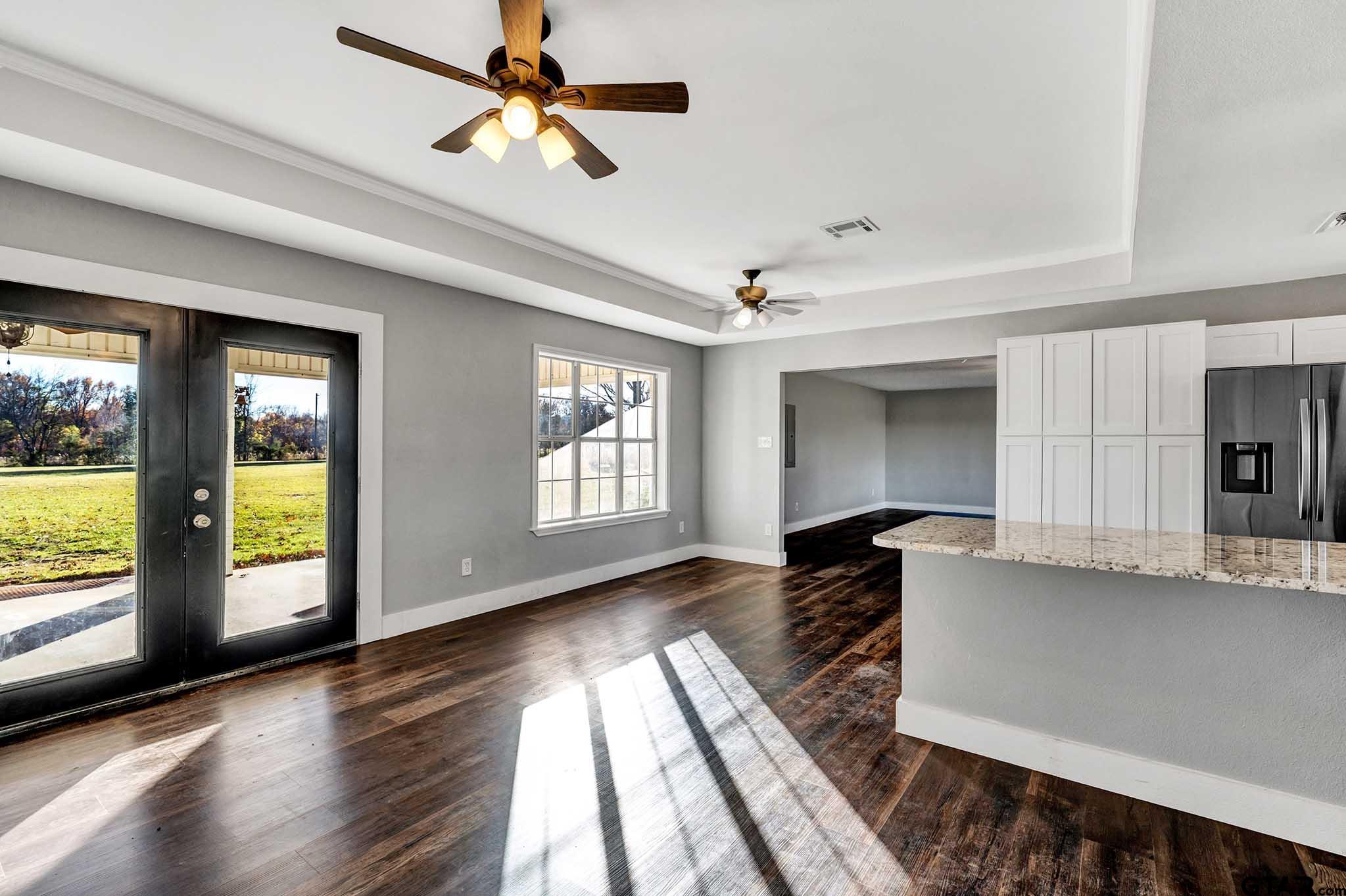 11670 Cr 345 Winona Tx 75792 Winona, TX 75792 - Photo 4 of 39 a view of empty room with wooden floor and fan