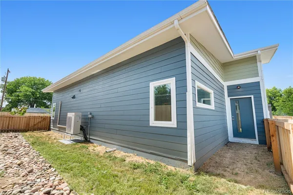 a view of house with backyard