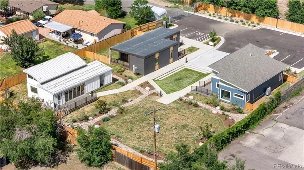 an aerial view of a house with a yard