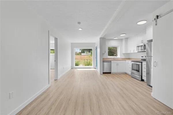 a view of a kitchen with a sink cabinets and a window