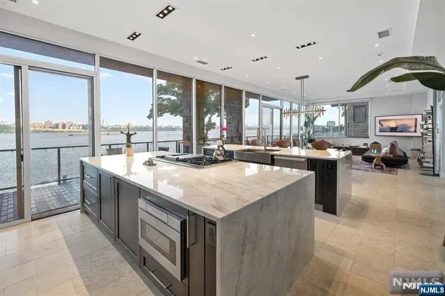 a kitchen with a sink appliances and cabinets
