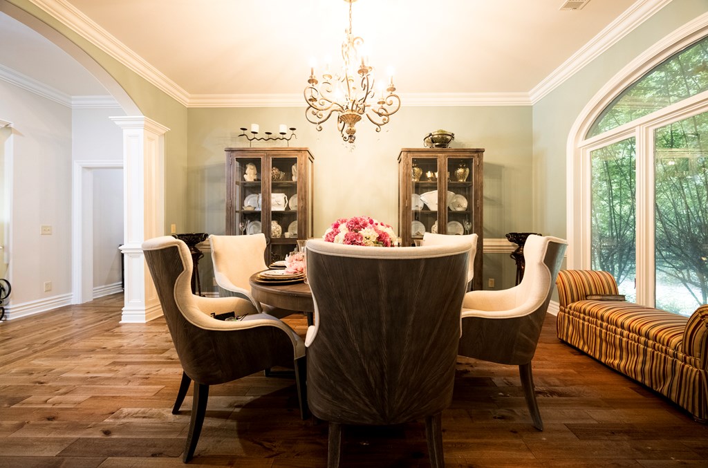 595 Grey Rock Drive Midland, GA 31820 - Photo 11 of 95 a dining room with furniture a chandelier and wooden floor