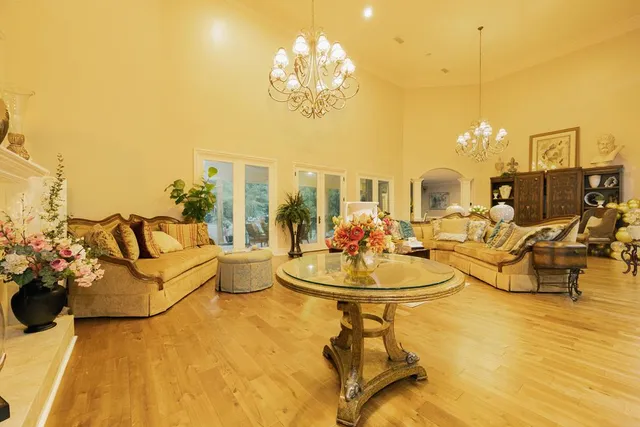 a view of a livingroom with furniture and a flat screen tv
