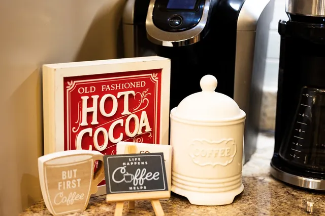 a bedroom with furniture and a large window