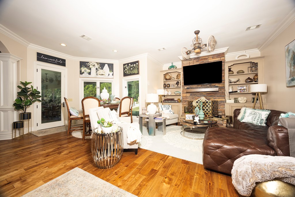 595 Grey Rock Drive Midland, GA 31820 - Photo 25 of 95 a living room with fireplace furniture and a flat screen tv