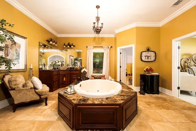 a view of a house with backyard porch and sitting area