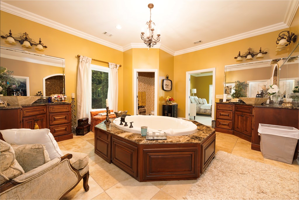 595 Grey Rock Drive Midland, GA 31820 - Photo 39 of 95 a living room with couches a flat tv screen and kitchen view