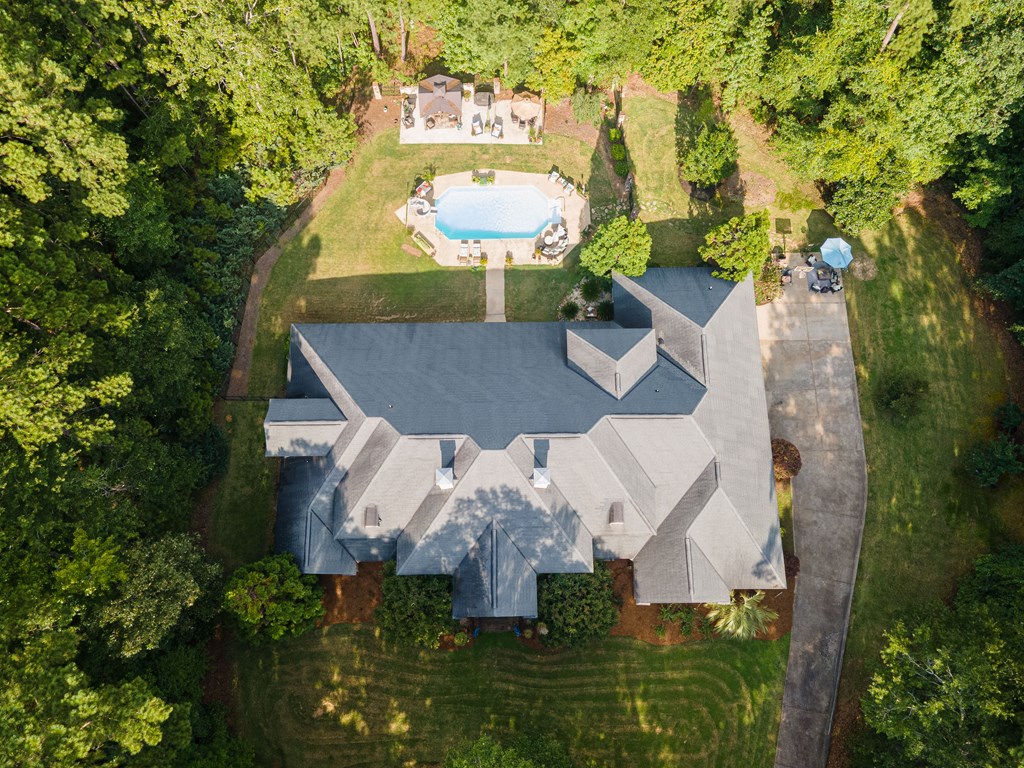 595 Grey Rock Drive Midland, GA 31820 - Photo 4 of 95 an aerial view of a house with yard swimming pool and outdoor seating