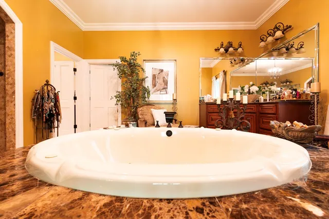 a view of house with outdoor space and swimming pool