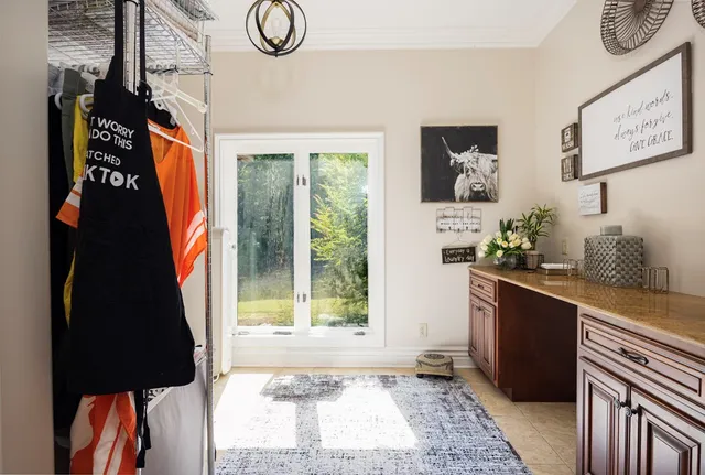 a view of a field with trees in the background