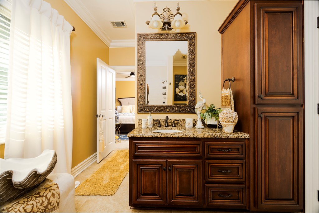 595 Grey Rock Drive Midland, GA 31820 - Photo 64 of 95 a bathroom with a granite countertop sink and a mirror